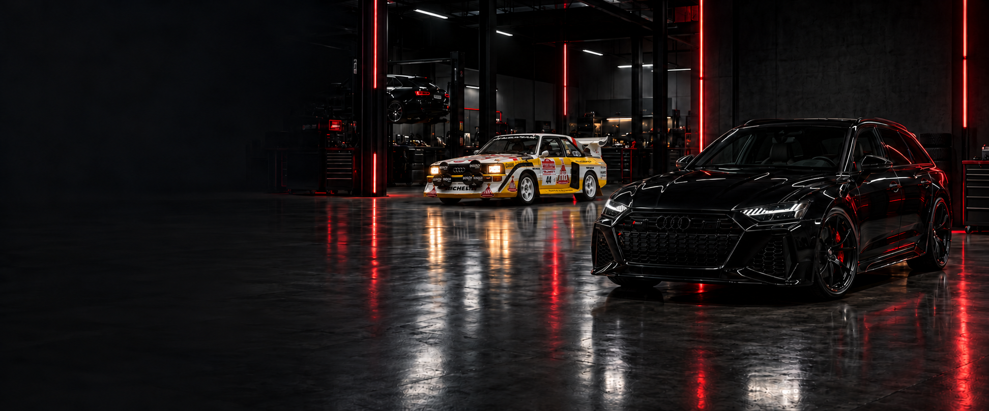 An Audi quattro rally car and a modern Audi in a garage